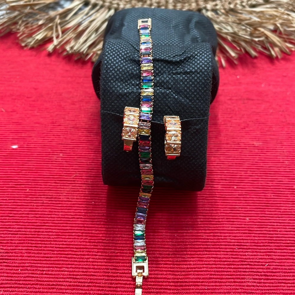 Multi-colored crystal bracelet in rose gold with a matching mono-toned earrings.